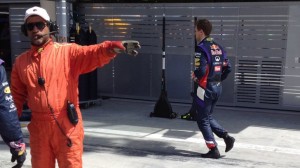 Sebastian Vettel walks back to the garage after the RB10 failed to complete a single lap.