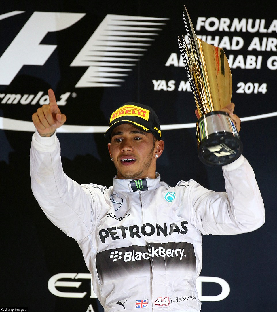 Hamilton celebrates his 2014 Formula One world championship.