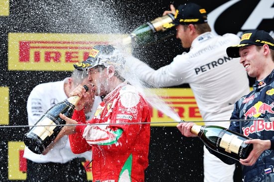 Rosberg, Vettel and Kvyat spray the obligatory champagne on the podium at the end of the 2016 Chinese Grand Prix. [Photo credit: Red Bull]