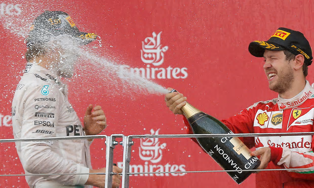 The most exciting portion of the race occurs as Vettel douses Rosberg with celebratory champagne after the 2016 European Grand Prix in Baku, Azerbaijan.