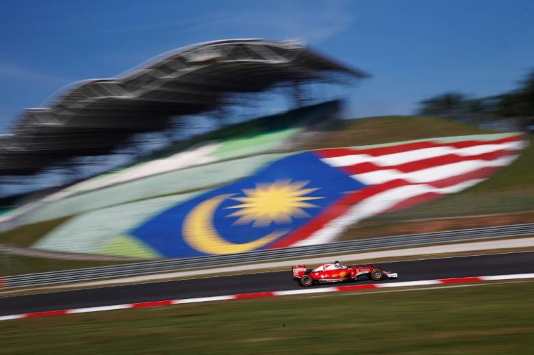Formula One - F1 - Malaysia Grand Prix - Sepang, Malaysia- 30/9/16 Ferrari's Sebastian Vettel of Germany in action during first practice.REUTERS/Edgar Su