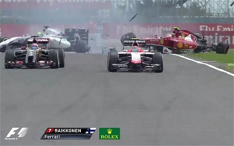 Ferrari's Kimi Raikkonen and Felipe Massa of Williams-Mercedes collide on the opening lap.