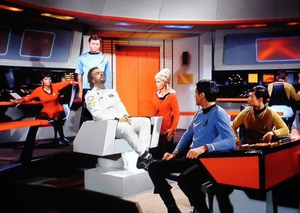 in Captain Kirk's chair in the original [and best] Star Trek