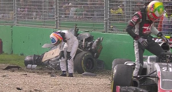 Alonso emerges after his crash - he will miss the 2016 Bahrain Grand Prix.
