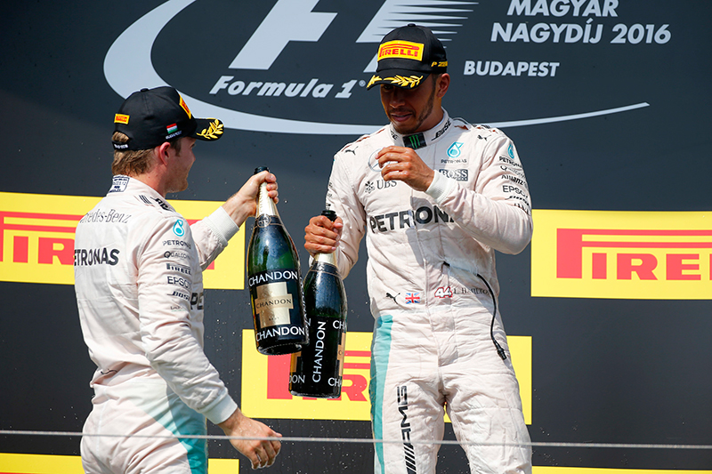 Mercedes teammates Lewis Hamilton and Nico Rosberg pretend to like each other after their 1-2 finish at the 2016 Hungarian Grand Prix.